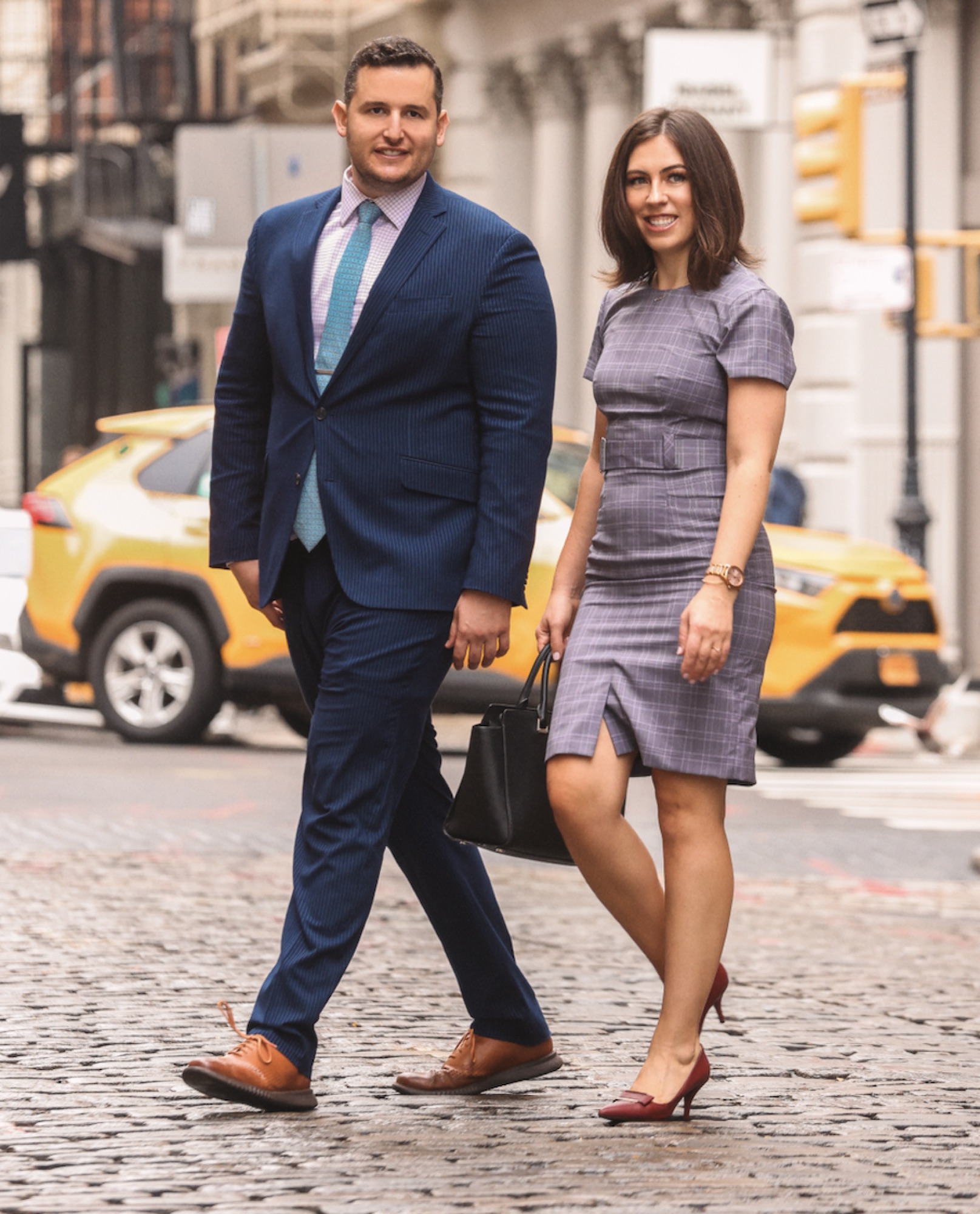 Andreea Miller and Steven Markowicz of The Miller Markowicz Team walking together in Manhattan